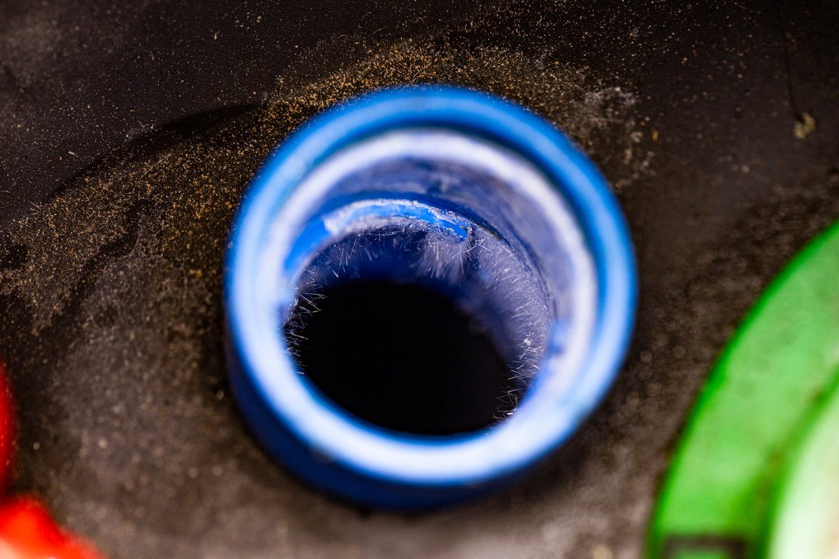 DEF tank filler neck with blue cap removed