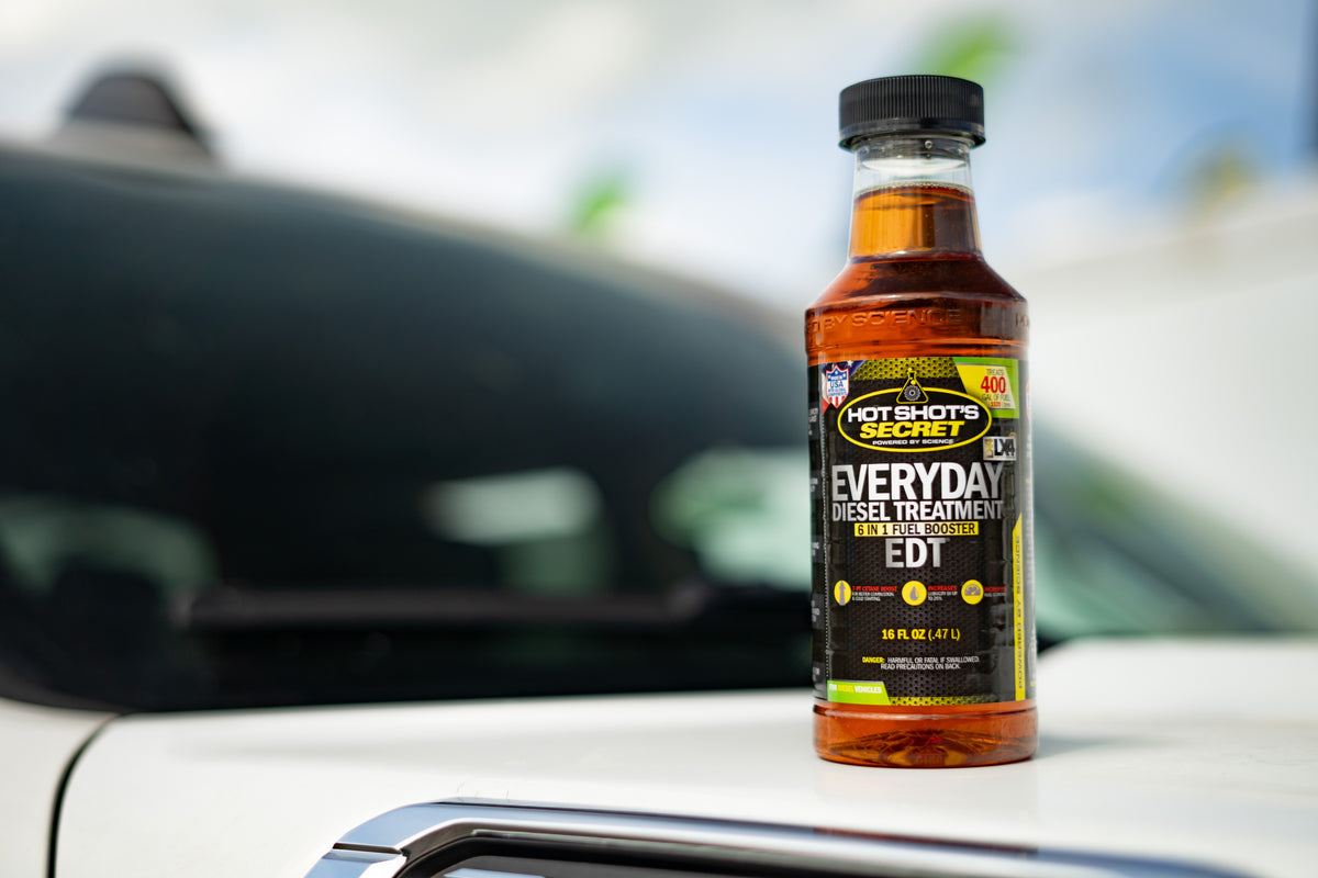 Everyday Diesel Treatment bottle on the bonnet of a vehicle