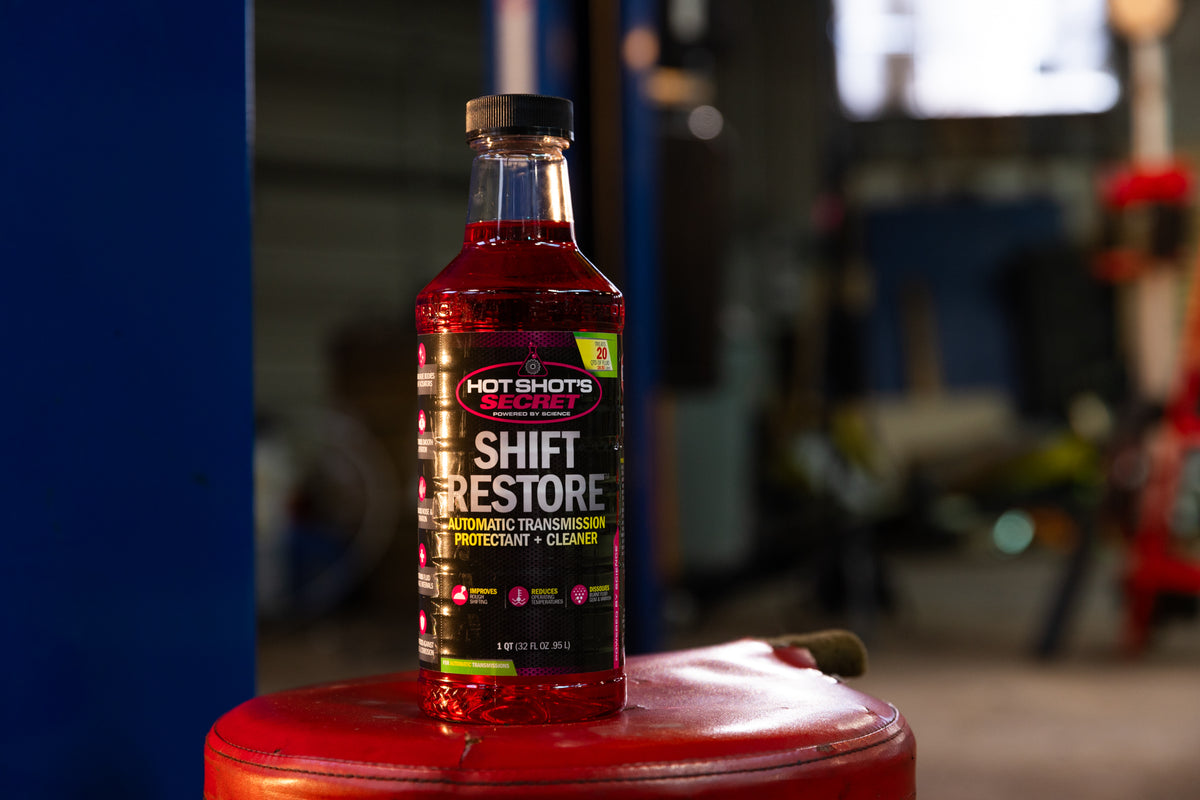 Shift Restore 946mL bottle in a workshop